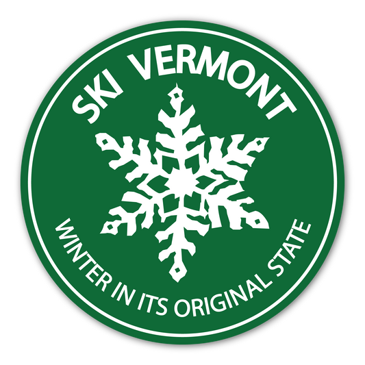Round green Ski Vermont sticker with a large white snowflake and the text “Winter in its Original State.”